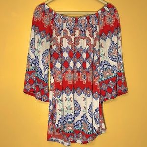 Tunic with curved hem